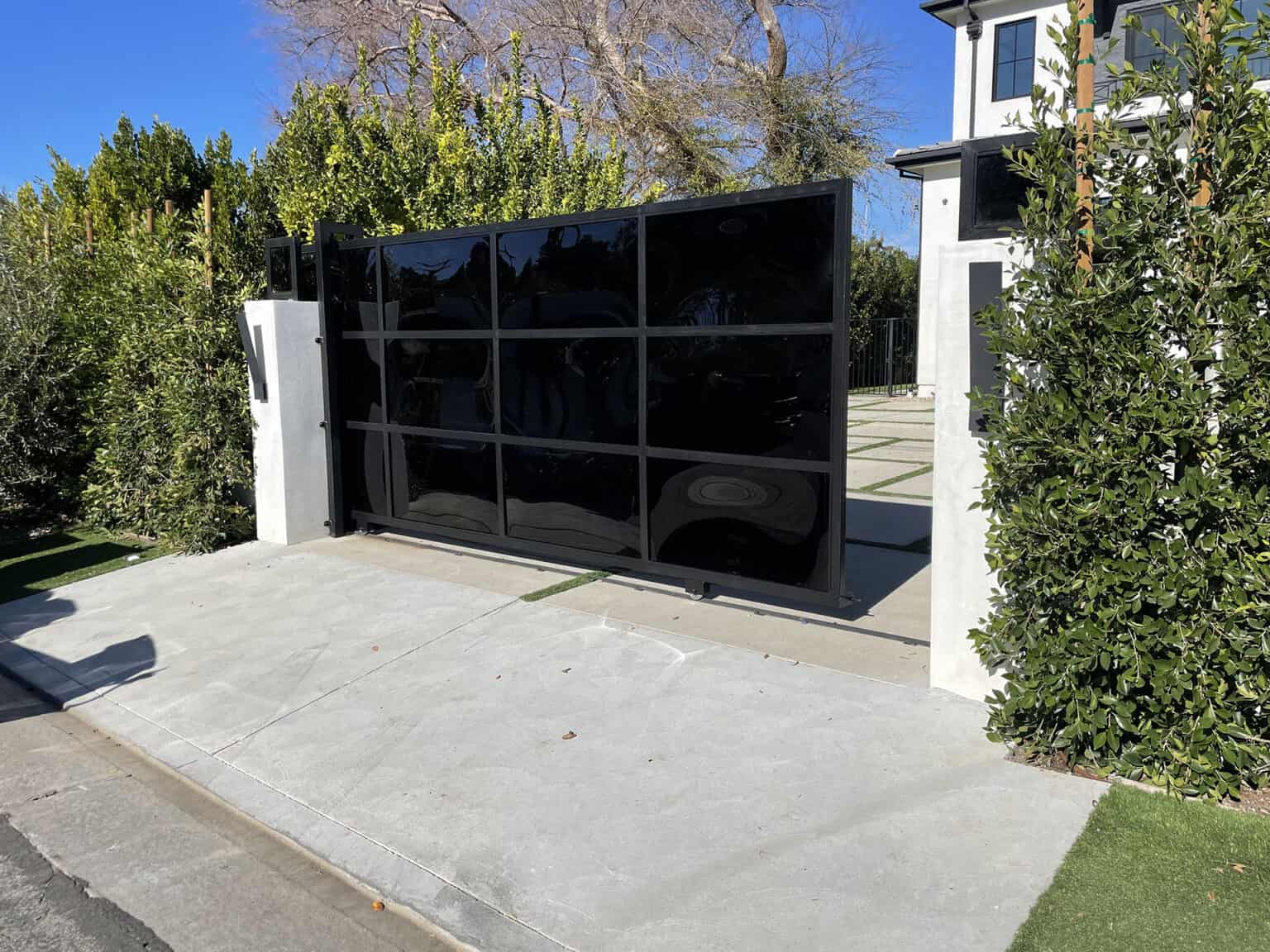 Homepage black glass and metal modern driveway gate