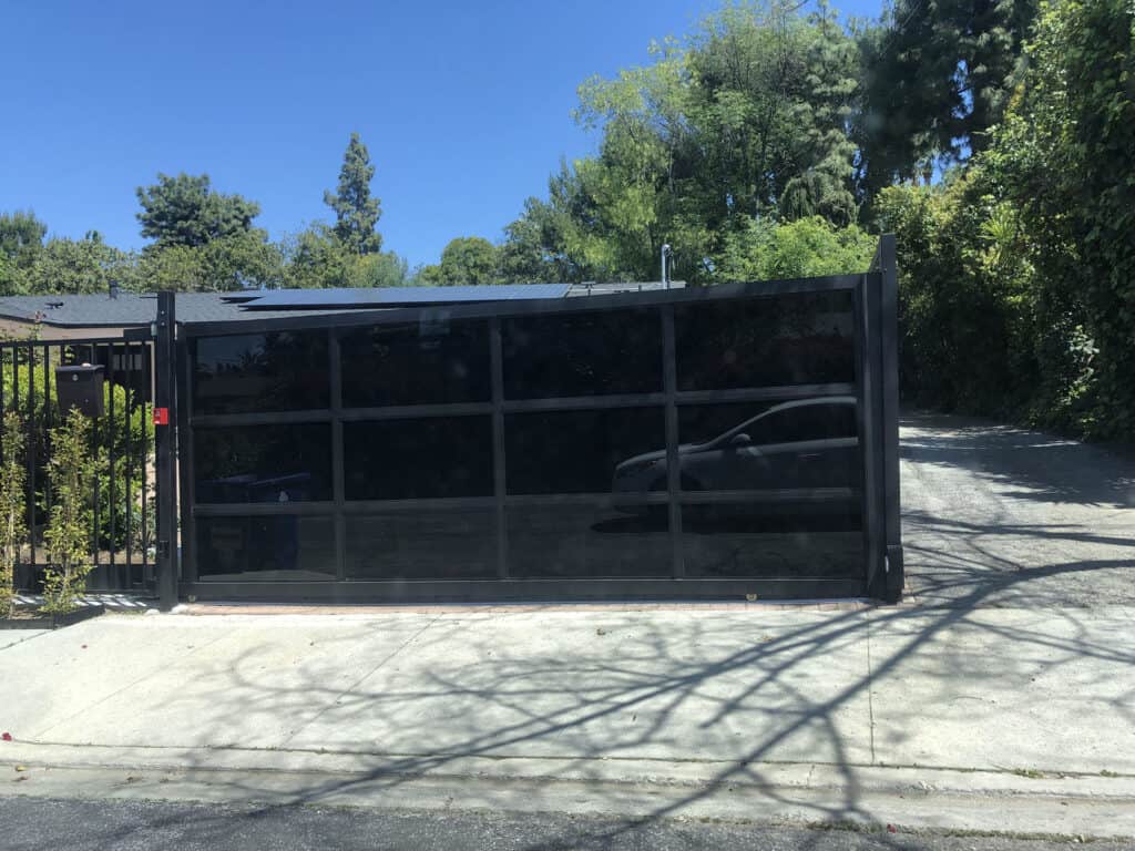 black glass metal sliding driveway gate