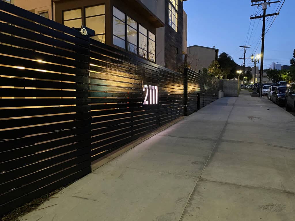 Fencing black horizontal slat fence illuminated house numbers