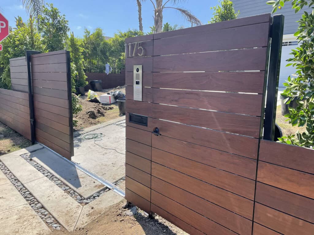 dark walnut horizontal slat fence video intercom gate
