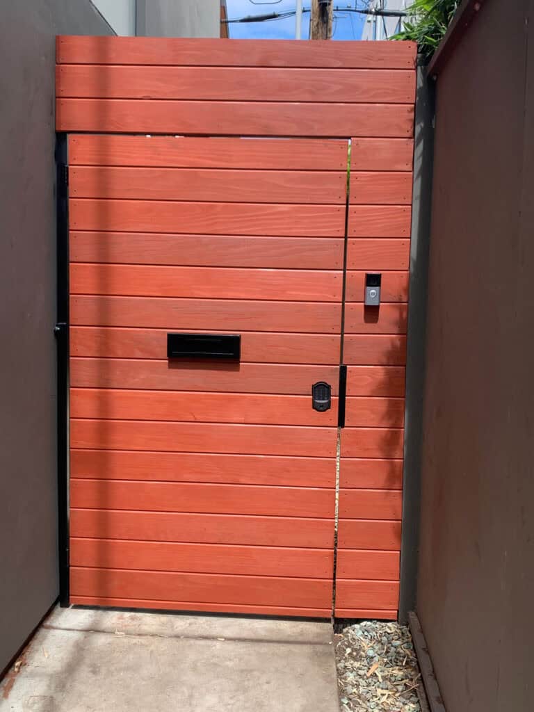 horizontal redwood pedestrian gate smart lock mail slot
