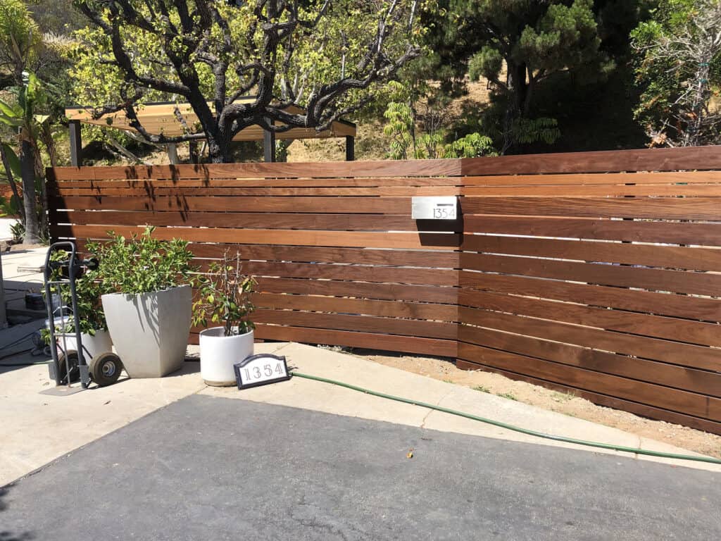 ipe wood horizontal slat fence with mailbox