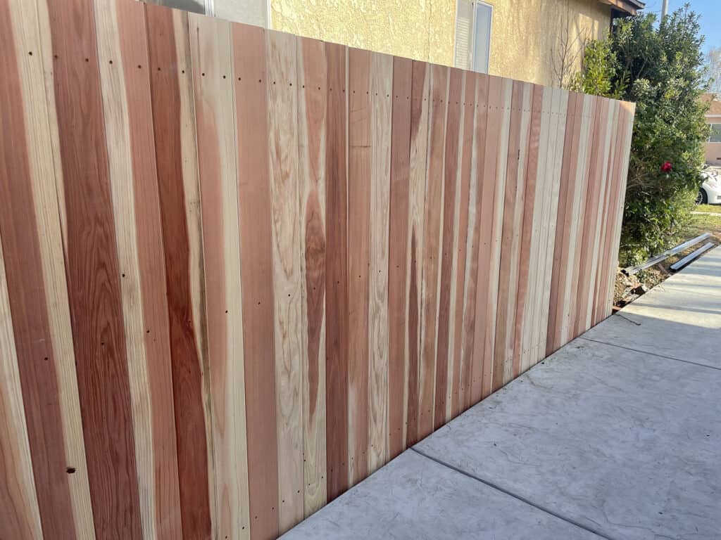 vertical redwood privacy fence driveway